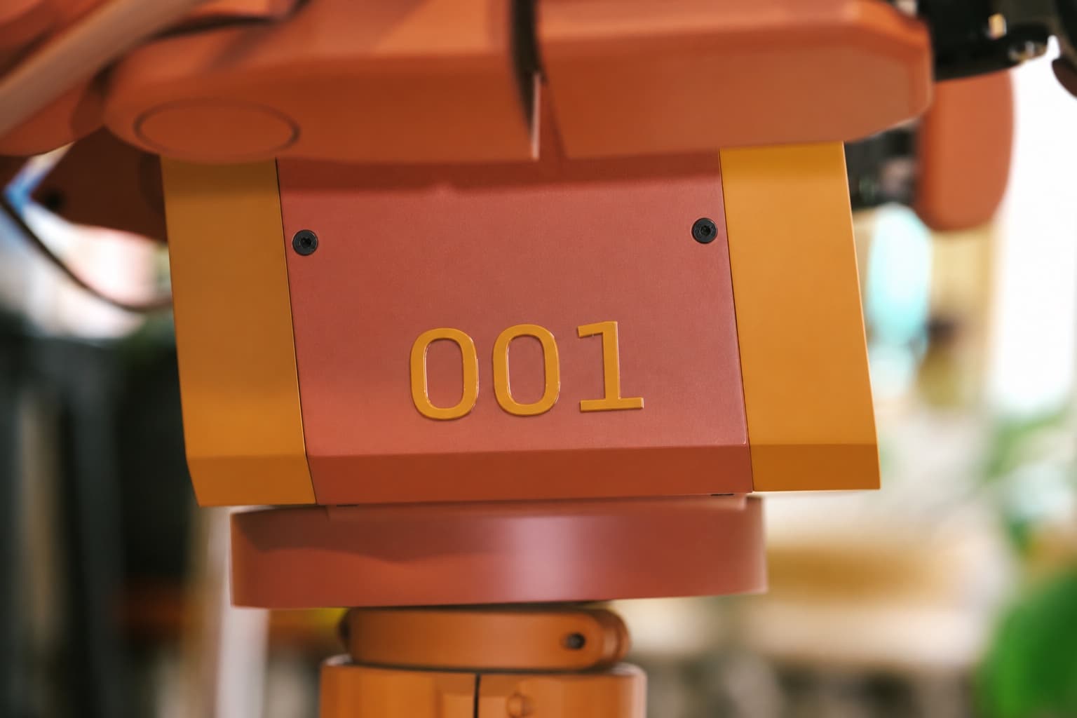 Close-up of Voxel’s orange head, numbered 001.